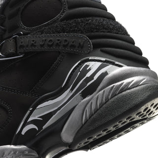 Youth Air Jordan sneakers close-up: black upper with Air Jordan wordmark and silver graphic
