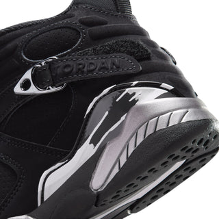 Kids black sneaker close-up showing JORDAN wordmark and molded side panel