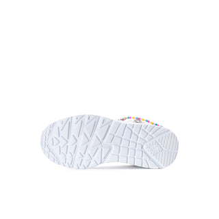 Kids' white sneaker outsole with molded tread pattern and colorful trim