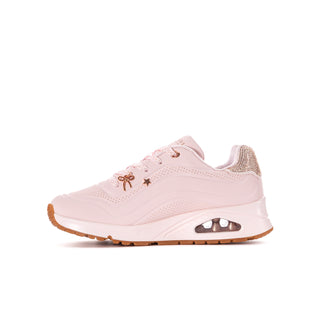 Side view of a light pink youth Skechers Uno Gen1 sneaker with charms and a visible air-cushioned heel.