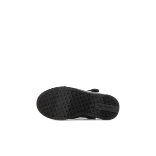 Black Mary Jane shoe sole with textured tread.