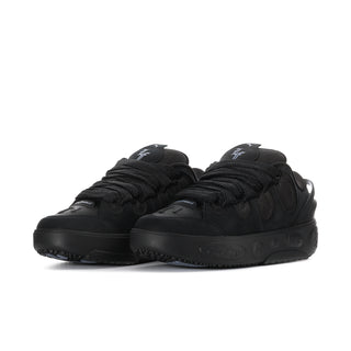 Black lace-up skate sneakers with thick rubber outsole and side PUMA logos