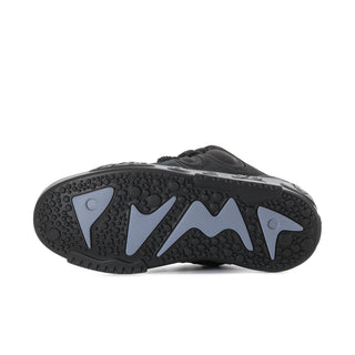 Black skate shoe outsole tread with circular traction pods and raised grip