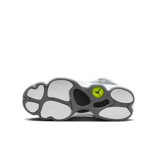 Youth sneaker outsole with tread pattern and lime green Jumpman logo.