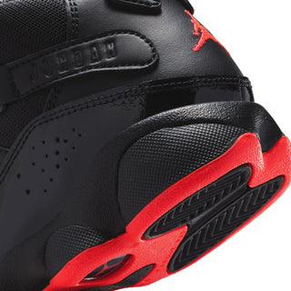 Kids black high-top sneaker detail, red Jumpman and textured sole, close-up
