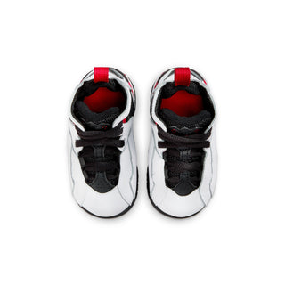 Toddler sneakers top view: white leather, black toe and laces, red pull tab