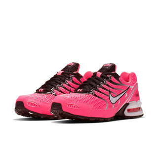 Womens pink Nike Air Max Torch 4 sneaker with black laces, black swoosh, side profile