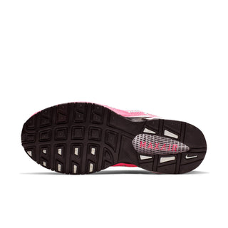 Womens Nike Air Max Torch 4 shoe bottom view, dark rubber outsole tread with red accents