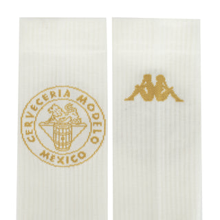 Pair of white ribbed crew socks with gold logos: circular mark and small emblem