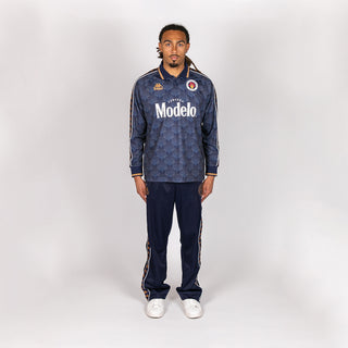 Men's navy track pants with side stripe accents and logo patches