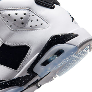 Youth high-top sneakers close-up: white leather, black swoosh, clear light-blue sole.