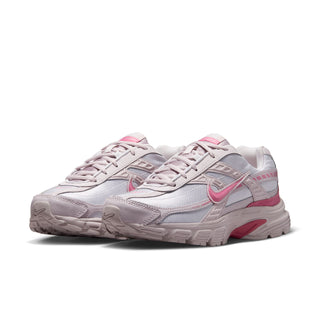 Light gray and pink women's sneaker, angled view of lace-up upper