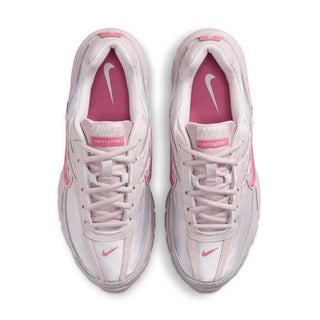 Pair of light gray and pink women's sneakers with laces and tongue branding