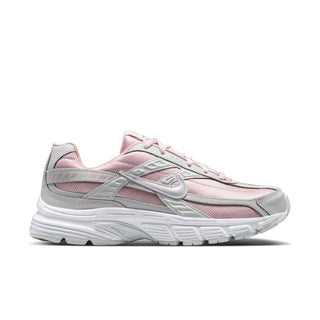 Women's sneakers angled side view, light pink upper with gray accents and white sole