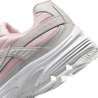 Women's sneaker side close-up, gray trim and white ribbed midsole
