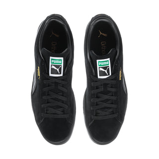 Black suede low-top sneakers front view with lace-up and Puma tongue labels.