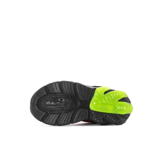 Kids sneaker outsole with neon green heel tread and textured black grip