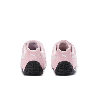 Pink Puma sneakers with dark tread outsole and cushioned heel
