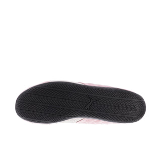 Black tread outsole of a pink Puma sneaker