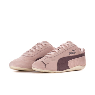 Pair of mauve low-top lace-up sneakers with dark side panels and Puma logo