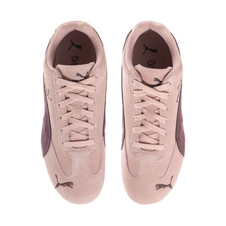 Women's mauve sneakers showing padded tongues and Puma logo on inner lining