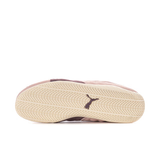 Mauve sneaker outsole with textured tread pattern and Puma logo