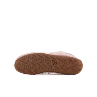 Youth sneaker outsole with brown traction tread and small PUMA mark