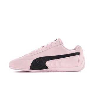 Women’s Puma Speedcat side view sneakers in powder pink with black stripe
