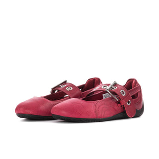 Pair of red mary jane ballet flats with double straps, silver buckles, and black outsole