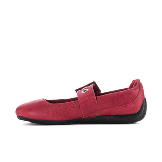 Red ballet flat shoe with single top strap, silver buckle, and black sole