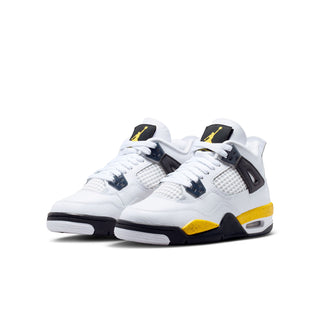 Youth low-top sneakers, white mesh and leather look with black panels and yellow accents.