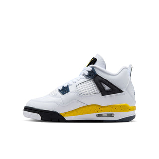 Youth white low-top sneakers with black ankle strap and yellow midsole stripe.