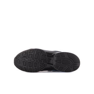 Outsole of black youth sneaker with patterned traction tread