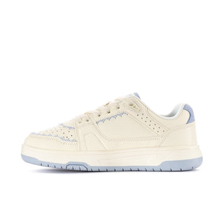 Women's low-top sneaker side view in off-white with blue star detail and stitching