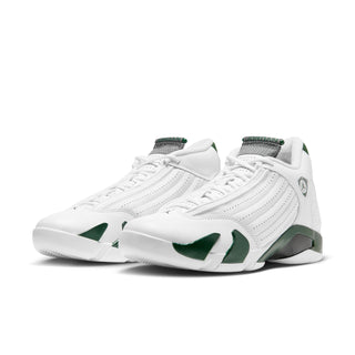 Pair of white and green low-top sneakers with lace-up front and vented panels