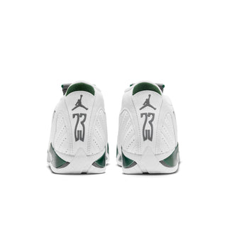 White high-top sneakers with green heel accents and Jordan logo on back