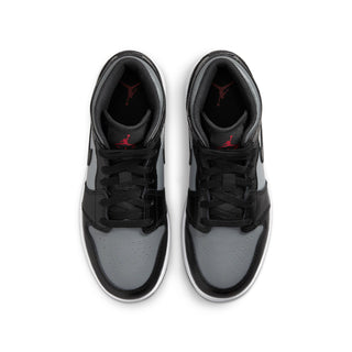 Pair of youth mid-top sneakers showing toe and laces; black, gray, white with red lining
