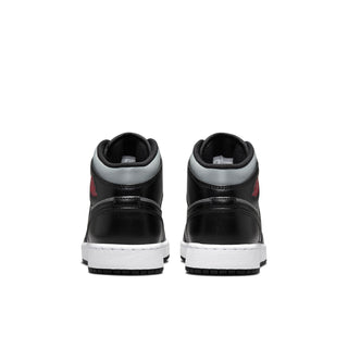 Youth mid-top sneakers heel view in black and gray with white midsoles and tread