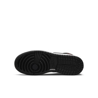 Youth mid-top sneaker outsole in black rubber with textured tread pattern
