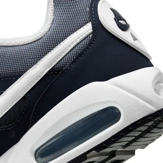 Close-up of navy and white midsole with Air window and textured outsole detail