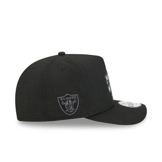 Black baseball cap, side view, Raiders shield logo patch and curved brim