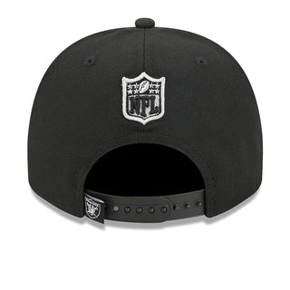Black baseball cap back with white NHL crest patch and adjustable snapback strap