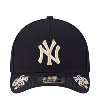 Navy baseball cap with white Yankees logo embroidery on the front panel