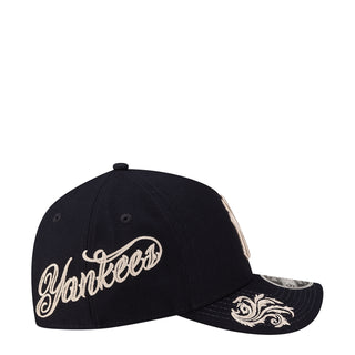 Navy A-frame cap with script Yankees wordmark and decorative side embroidery