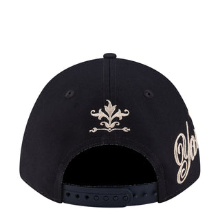 Navy cap with white fleur-de-lis front embroidery and New Era logo patch