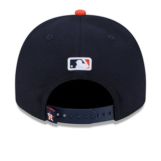 A-frame baseball cap, navy crown with orange brim, MLB logo patch on back
