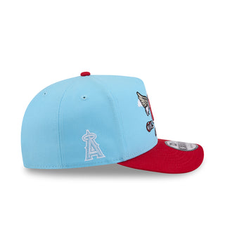 Light blue A-frame baseball cap with red brim and side LA Angels cartoon emblem