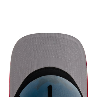Baseball cap interior close-up with gray fabric, black band, and stitched seams
