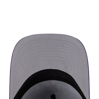 Gray underside and stitched vent holes of a purple snapback cap