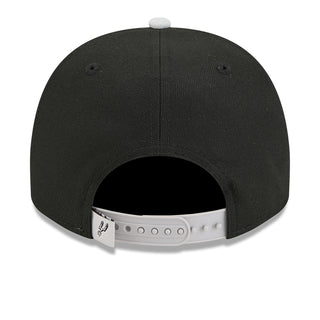 Black baseball cap back view with adjustable gray strap and eyelets